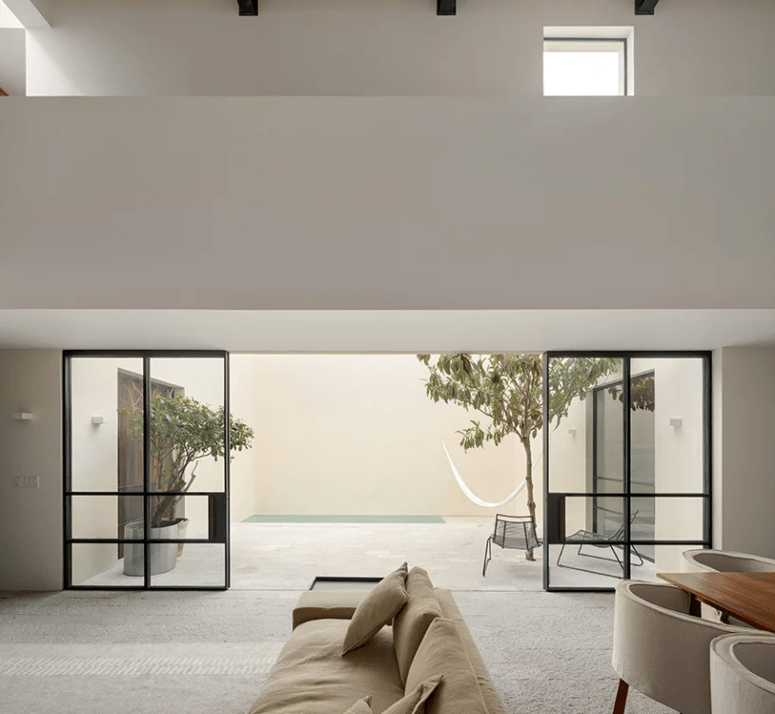 The living room is opened to another courtyard with a plunge pool and a hammock