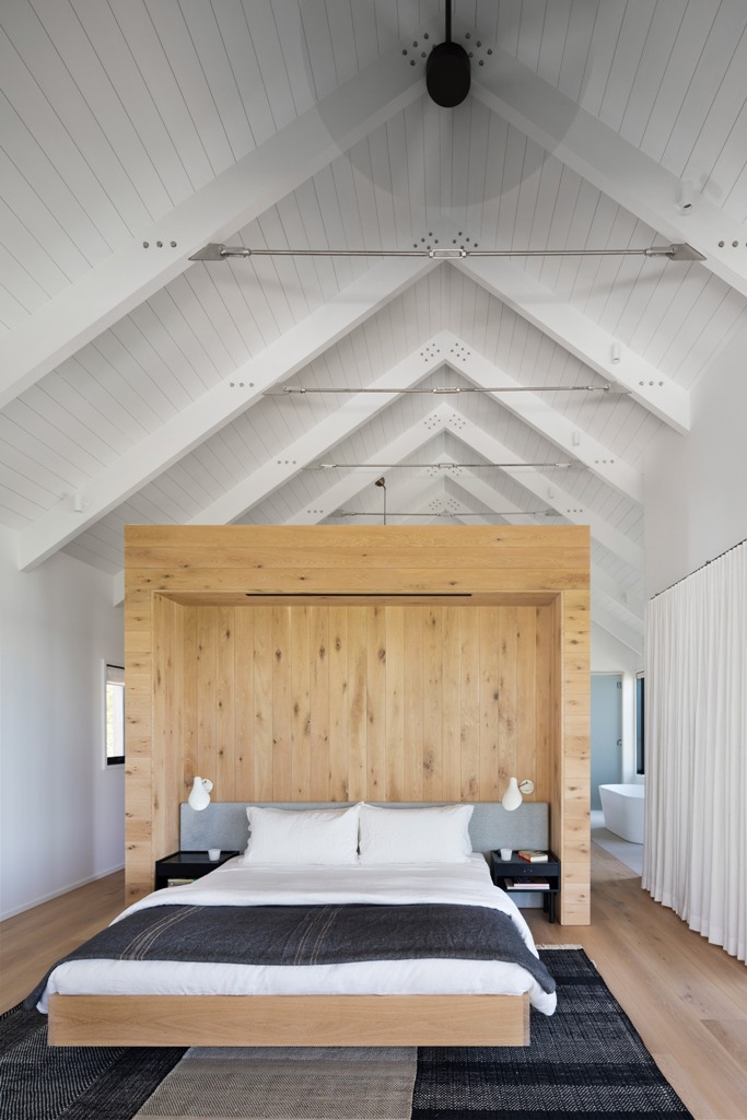 The master bedroom is defined with a large cedar box, which separates it from the bathroom