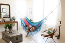 05 a colorful hammock hung in an alcove is a fun and bright touch to any neutral space