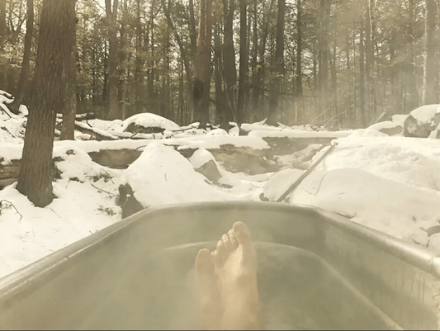 A hot tub is also present to feel full relaxation in a snowy forest