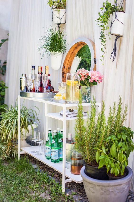 a glam outdoor bar made of an IKEA Micke desk is a genius idea and the piece looks very elegant
