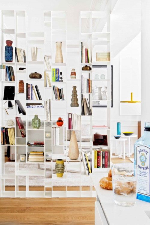 a large white shelving unit looks lightweight and can accommodate a lot of things you may need