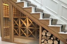 creative wine and firewood storage under stairs