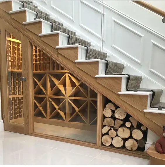 a modern wine cellar and firewood storage under the stairs adds to the interior