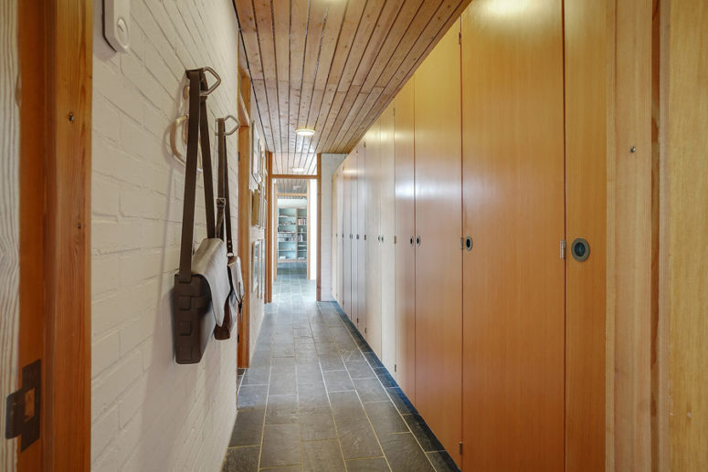 The corridor is also lined with similar wardrobes that are used for storage
