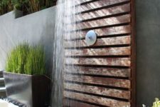 an outdoor spa made of wooden planks
