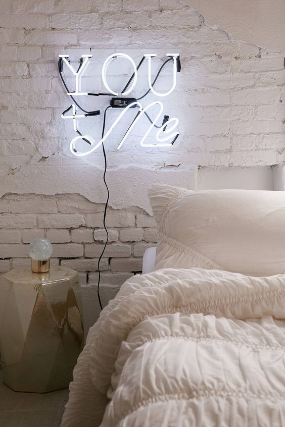 Highlighting your bedroom with a neon light is easy   use it instead of a usual sconce and your space will get that magic