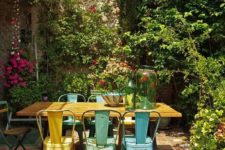 08 a relaxed shabby chic space with a wooden table and blue and yellow metal chairs