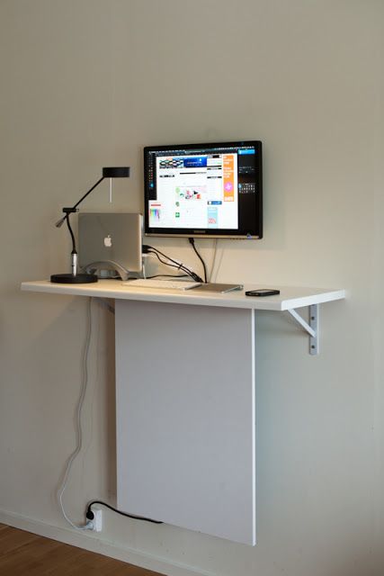a tiny wall-mounted desk with hidden cables can accommodate a laptop or a wall-mounted screen