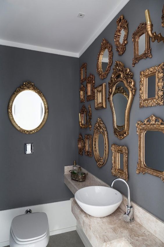 make your bathroom super refined and elegant hanging various gold antique frames on the wall