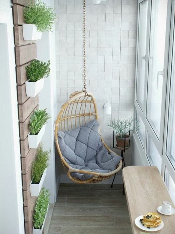 a hanging chair, wall-mounted planters, a folding table for having meals