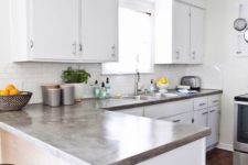 09 white kitchen with concrete countertops that add color and a texture to the space