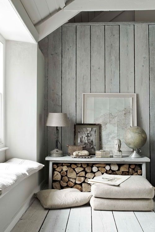 whitewashed greyish wood planks bring a coastal feel to the space and look very natural
