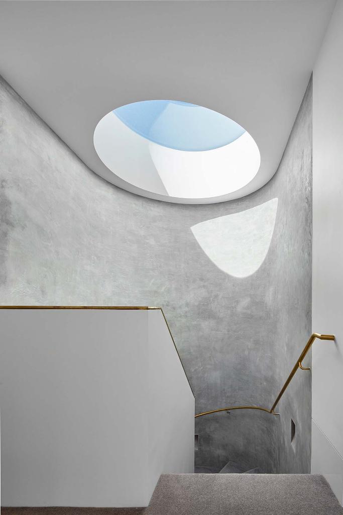 The staircase and space around it with a skylight looks somewhat space-like