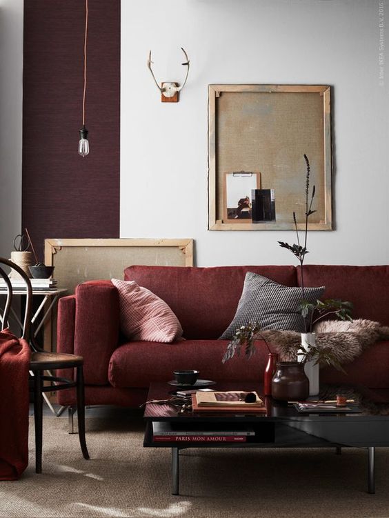 a moody living room with shades of plum and burgundy for a bold and creative look
