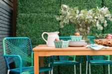 10 a neutral wooden table and bright turquoise string covered chairs for a modern space