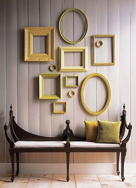 add a touch of color with a gallery wall in the shades of yellow and green and matching pillows