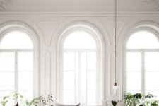 10 arched floor to ceiling windows create a refined and chic feeling in the space