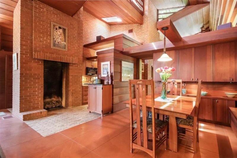 What a mid century house without a fireplace, and this one clad with red bricks is a great piece
