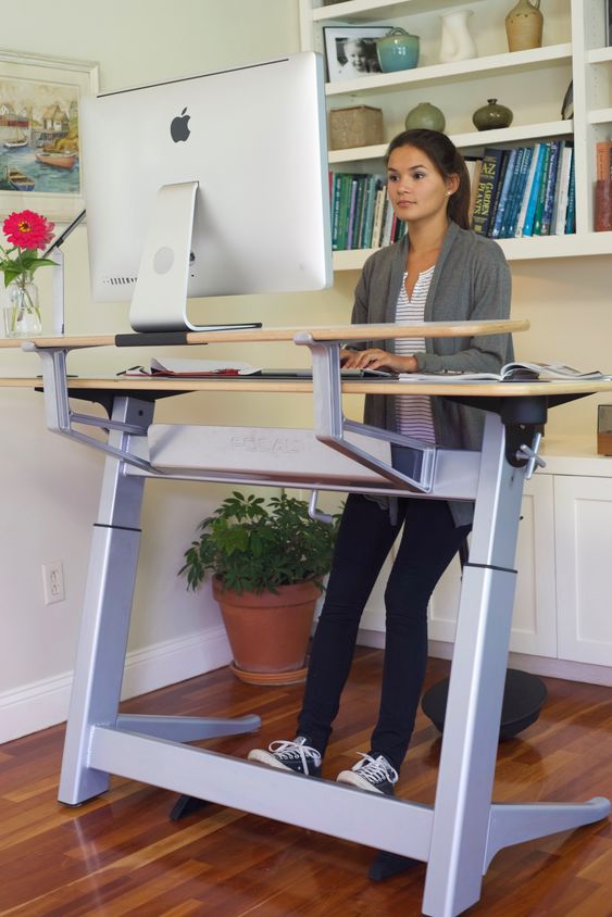 a large standing desk and a leaning stool will take some space but will make you fele comfortable