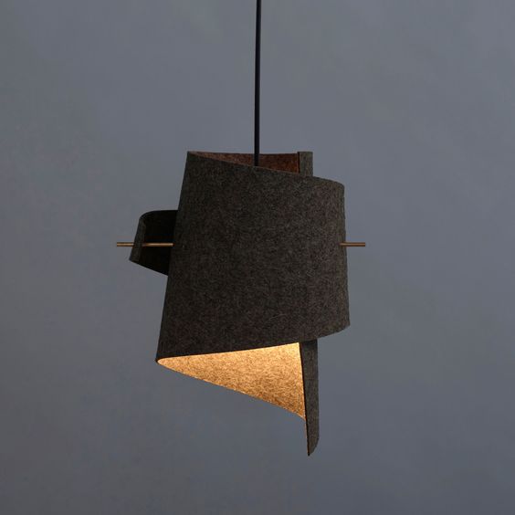 a sculptural woolen lamp with a meta stick to secure it for a bold look