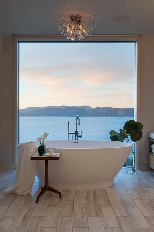 don't be afraid to make a floor to ceiling window even in the bathroom if the view is worth it