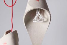 12 sculptural woolen lamps with red touches and red cords