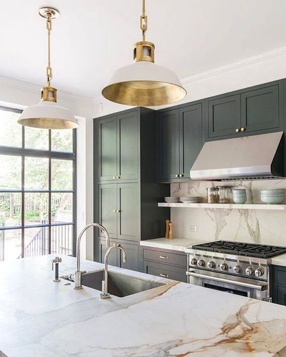 stainless steel of the appliances is the main here, and shiny gold adds to the space