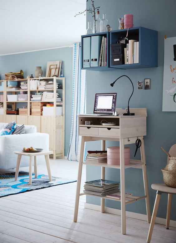A little light colored wooden standing desk won't take much space and is suitable for tiny spaces