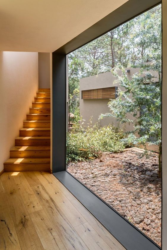 invite outside inside with such a gorgeous modern floor to ceiling window with no blocks for the view