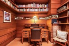 masculine home office with lots of books storage