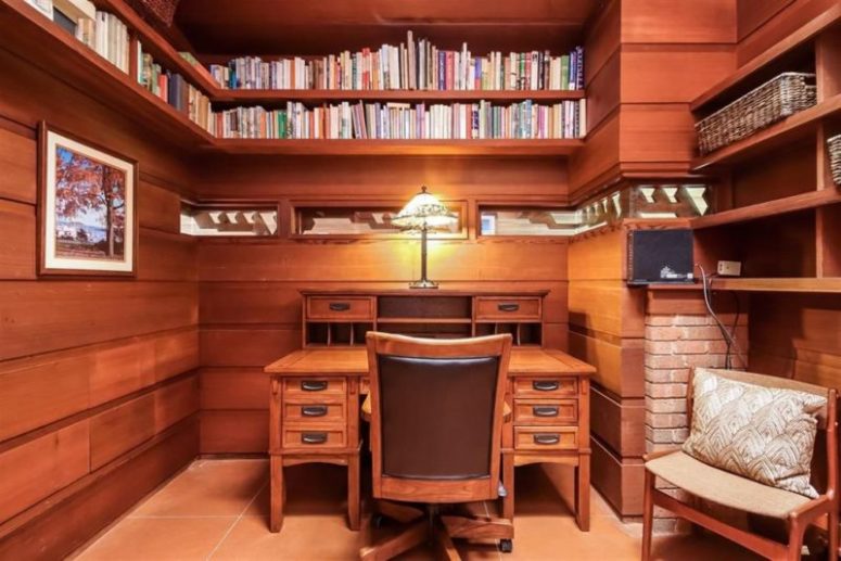 There's also a home office with lots of bookshelves going along the whole perimeter of the room