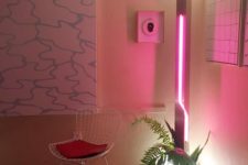 14 spruce up your space adding a party feel to it with a bright pink neon light and some tropical leaves
