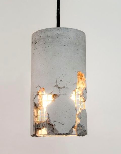 a cracking concrete pendant lamp is an amazing idea to give an industrial look to the space