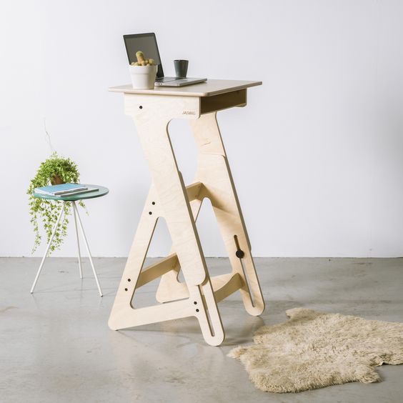 a small modern stand desk of high quality wood is a chic idea for a tiny space and looks stylish