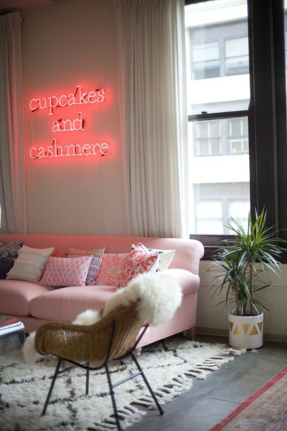 spruce up your girlish living room with a proper pink neon light over the sofa, so whimsy and glam