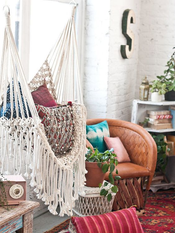 a boho space really requires a fringed hammock chair to complete it and bring an even more relaxed feel