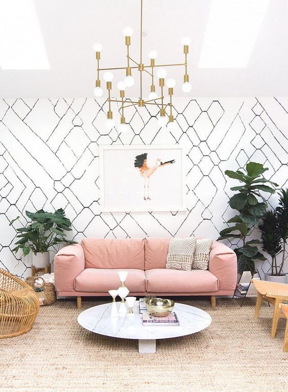 a mid-century modern living room with a dusty rose sofa for a soft colorful touch