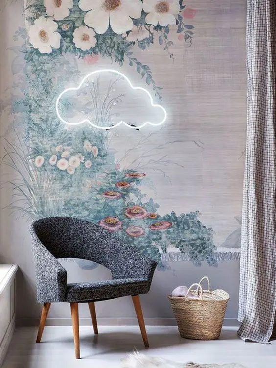 a cloud neon light over a chair in the reading nook creates a dreamy and welcoming ambience to enjoy