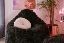 17 make your conversation space more glam with two fluffy bean bag chairs in black and pink pillows