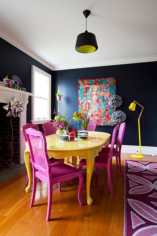 a dark space with several bright accents in magenta and bold yellow for a contrasting look