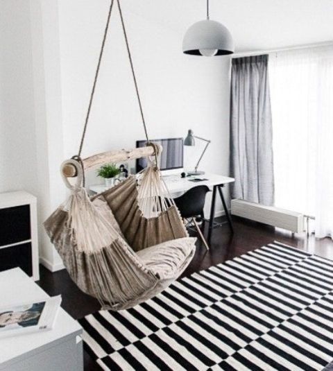a hammock chair as a unique and outstanding touch for a monochromatic Scandinavian space
