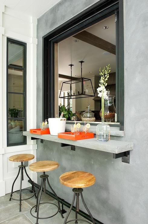 Attach a concrete windowsill outdoors and use the kitchen window to serve drinks