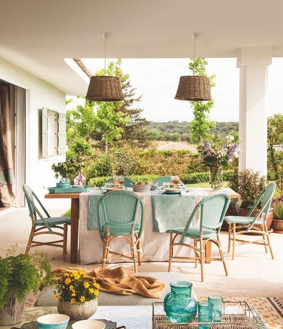 wicker turquoise chairs and wicker lampshades for a sweet rustic space with a Mediterranean feel