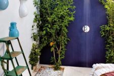 19 a gorgeous modern concrete shower with a navy wall and creamy floor plus living plants