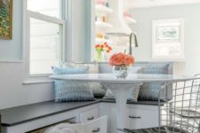19 a serene coastal breakfast space with a built-in banquette with drawers for storage