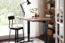 19 a stylish industrial desk of darkened metal and a wooden countertop plus a matching tall stool