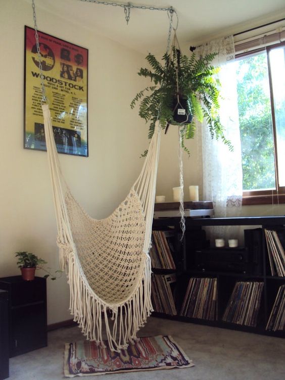 a hammock chair is a great alternative to a usual chair in the reading nook