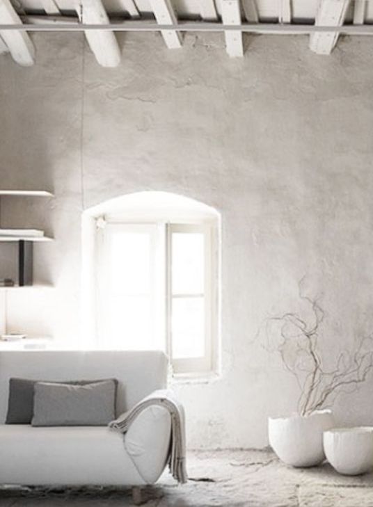 even the most neutral space will look bolder and more interesting with a grey plaster wall like this one