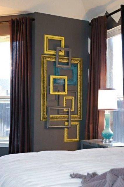 adding a sophisitcated touch to your bedroom is easy with some gilded and grey empty frames